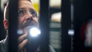 Tech Examining a forklift