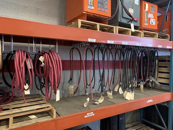 foxtron-warehouse-racking-cord-storage-5S A pallet racking unit with industrial forklift battery cables organized according to 5S principles