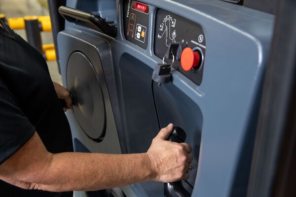 An operator manipulates the controls on a Toyota order picker