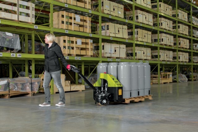 A worker moving pallet of cylinders with a CLARK model WP electric pallet jack