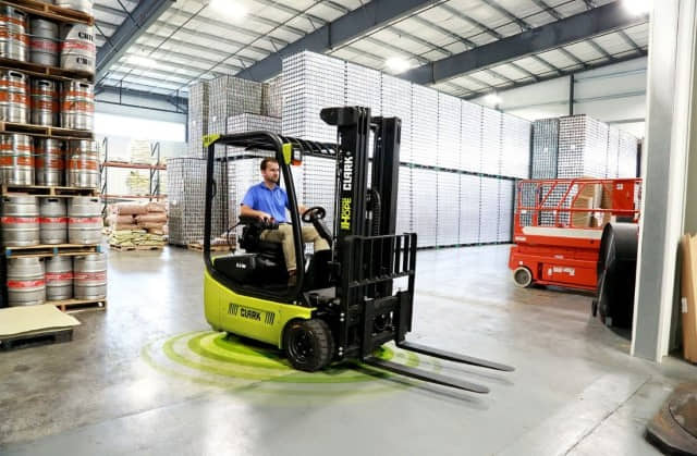 A CLARK 3-wheel electric forklift in a warehouse