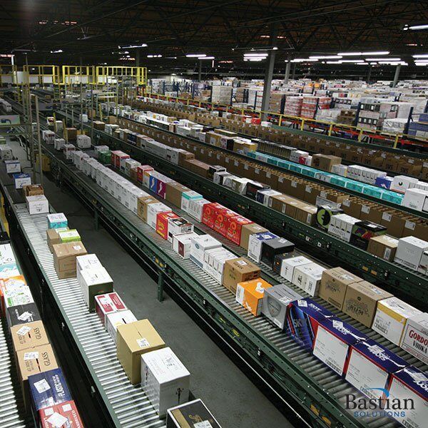 Automatic accumulator conveyor in a beverage distributor facility