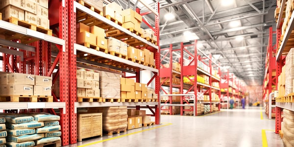 Pallets sitting on racking in front of racking in a warehouse