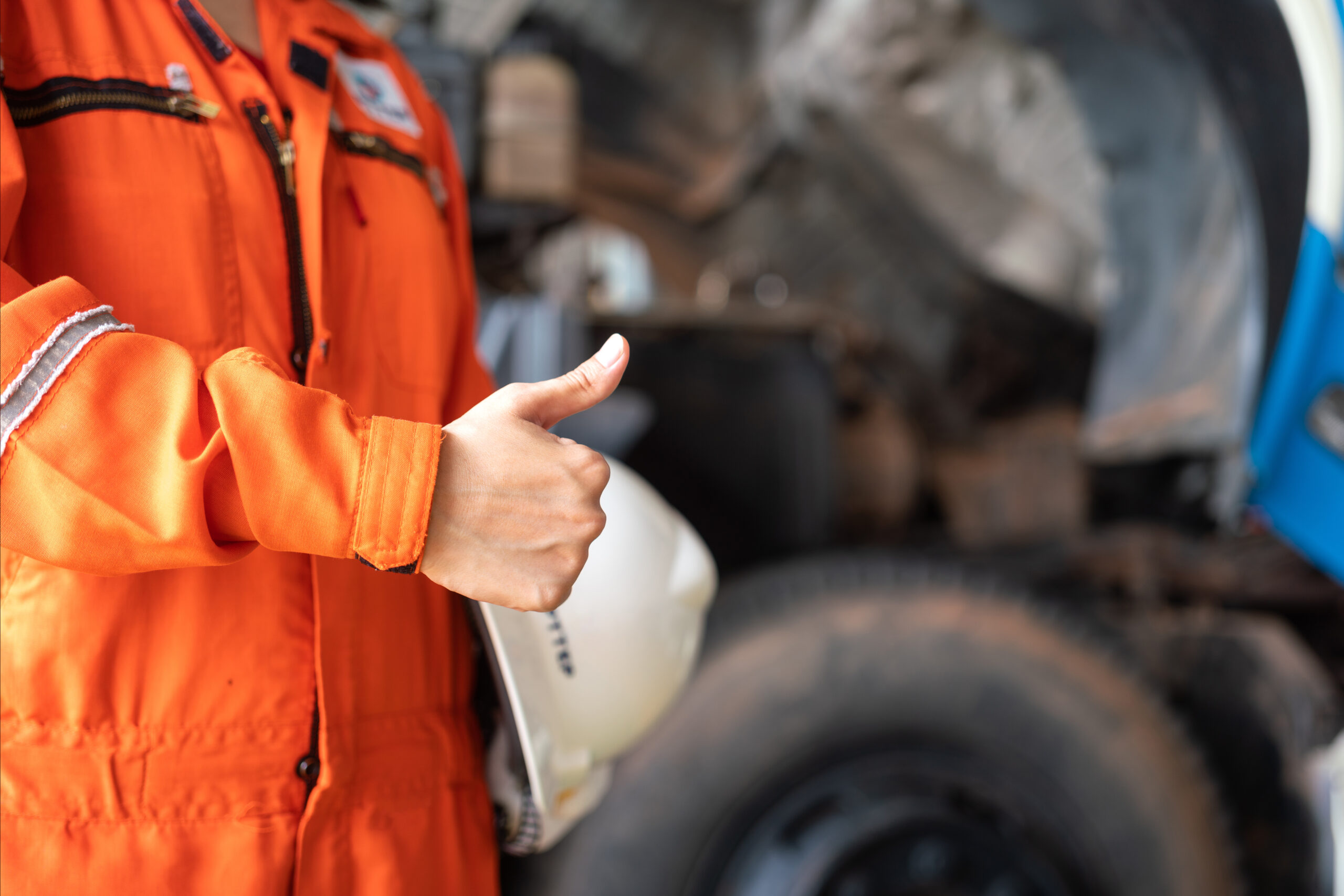 Worker giving the thumbs up for safety