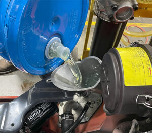 Add Hydraulic Fluid to the Fill Tube and Pump Fluid Into the Reservoir