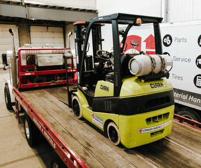 Clark forklift on rental trailer