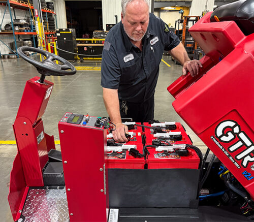 Tech working on Industrial Cleaning Equipment