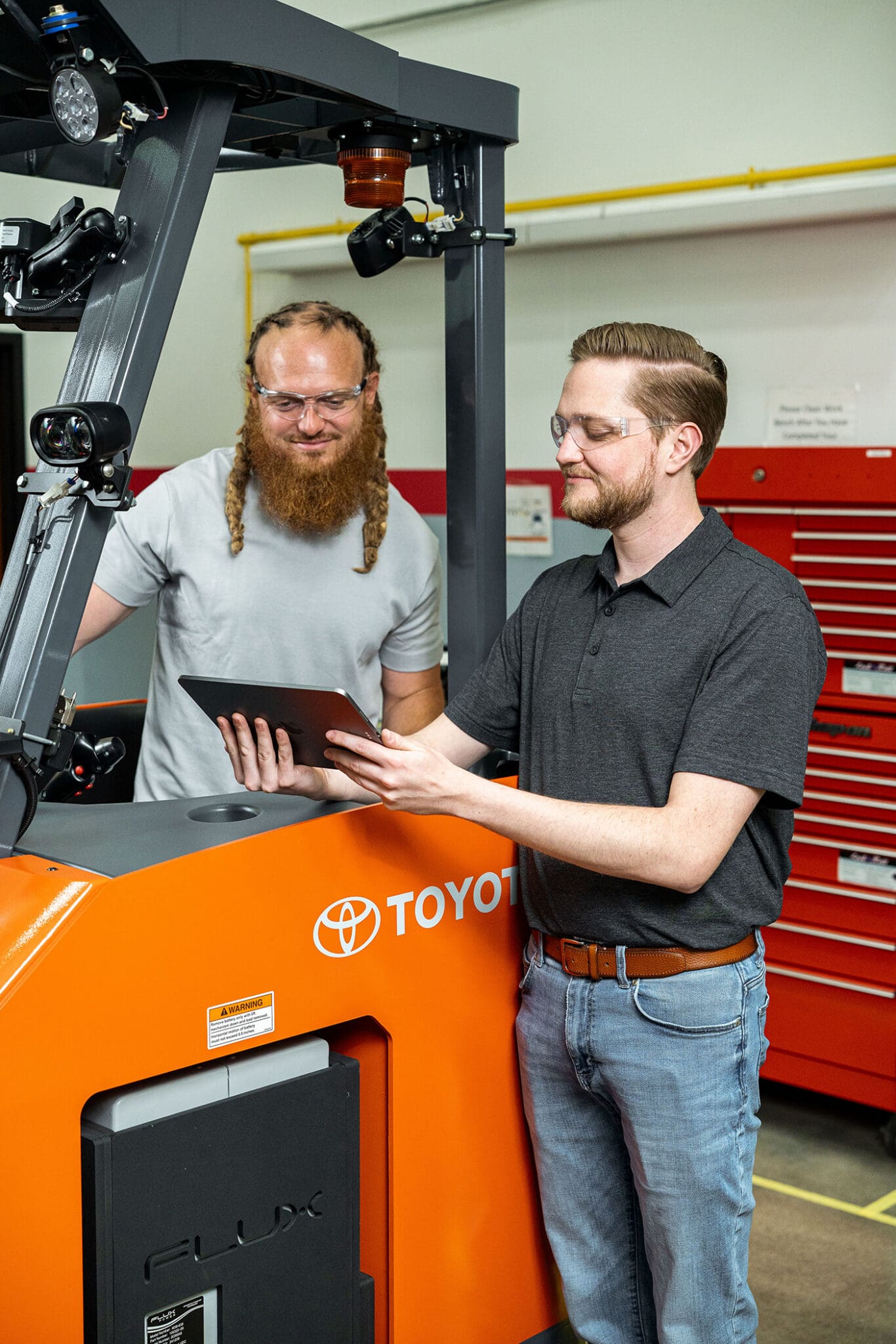Conger representative discussing Toyota MyInsights telematics with a customer